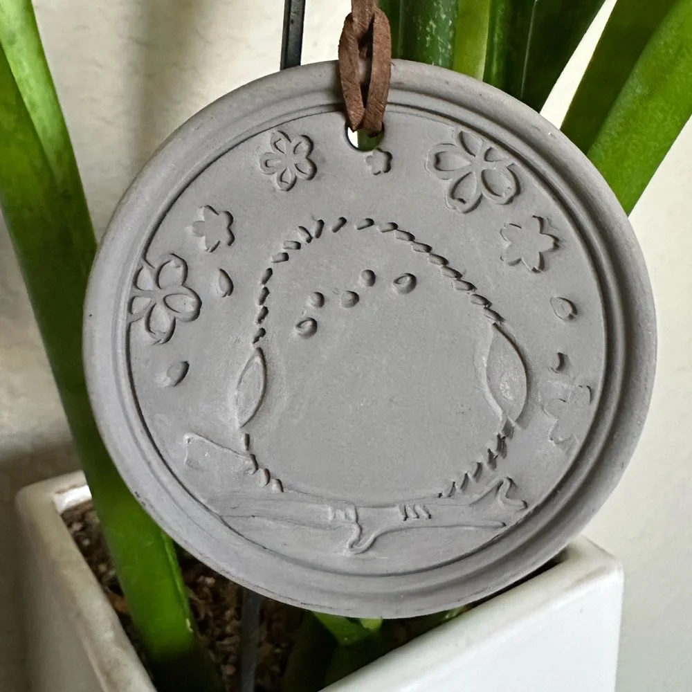 Round Ceramic Bird Wall Hanging in Matte Gray